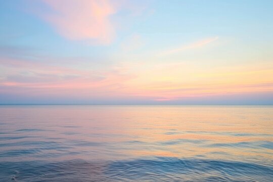 Serene Seascape with Pastel Sunset Sky - Tranquil Ocean Horizon