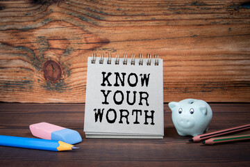 Know Your Worth. Cardboard notepad on wooden texture table - 786635683