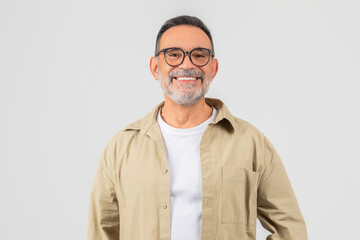 Smiling senior man with glasses and beard