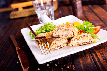 Dashimaki tamago, Japanese style rolled omelette in dish on wooden table - 786641628