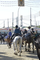 horses and riders in the world famous Feria de abril , seville,  andalusia 