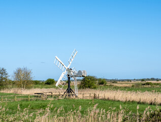 Naklejka premium Old, historic and defunct drainage Mill in Upton marshes in the heart of the Norfolk Broads National park