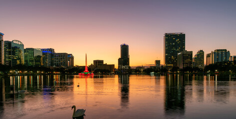 Panoramic view of Orlando city at sunset with fountain in Lake Eola, Orlando, Florida, USA