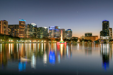 Orlando city skyline at night in Lake Eola, Orlando, Florida, USA
