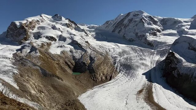 The snowy peaks of Switzerland. Mount Zermat in the sunlight from the observation deck.