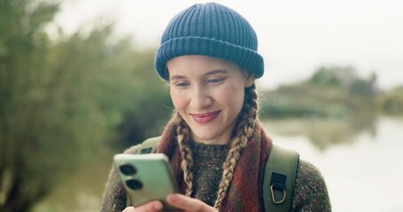 Woman, phone and hiking by a lake with eco travel blog, holiday and adventure writing on university break. Gap year, vacation and social media by water with a college student on journey in Oklahoma