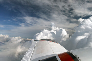 View from the porthole on the upper plane of the wing of the flying liner and the celestial...