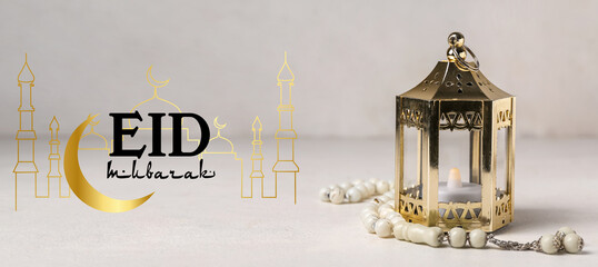 Muslim lantern with candle and prayer beads for Ramadan on light background