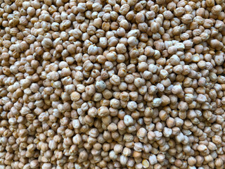 Dry organic chickpeas as background close up. Heap of white chickpeas. Food background. Biological food.