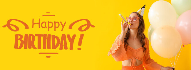 Beautiful young woman with party whistle and air balloons celebrating Birthday on yellow background
