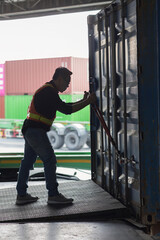 Warehouse worker Using  steel cutting Seal for open A Door Container. Safety Protect Cargo Transport. Shipping Cargo Container Truck.
