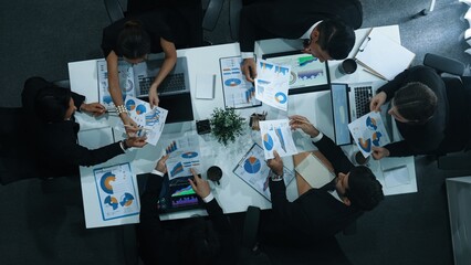 Time lapse of diverse marketing team prepare for business meeting. Top down aerial view of businesspeople placed laptop and tablet with financial statistic at table. Creative business. Directorate. - obrazy, fototapety, plakaty