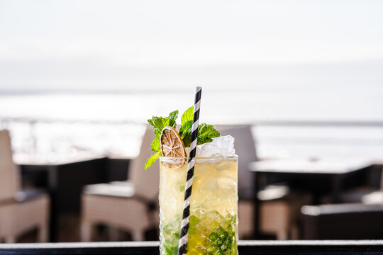 Refreshing cocktail with a beach backdrop in Miami