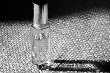 small perfume bottle  close-up. black and white. 