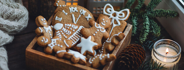 Traditional holiday homemade gingerbread cookies in vintage wooden box. Craft paper with Christmas...