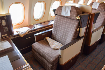Business class airplane seat. Luxury flying, comfort in the air.