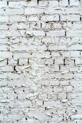A white brick wall with peeling paint. Suitable for backgrounds and texture designs