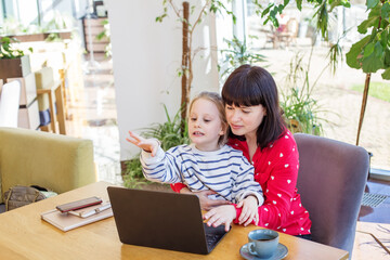 Engaged Child Learning with Mother at Computer