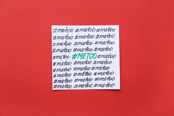 Paper with hashtags METOO on red background