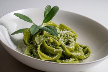 Pasta Bowl of green ravioli with sage and parmesan