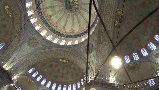  Istanbul, Blue mosque inside, view from below on the ceiling of the mosque, camera pans and circles across the ceiling