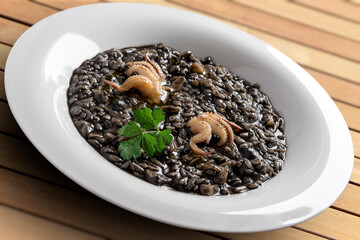 Dish of risotto with squid ink