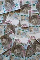 Polish 500 zloty banknotes scattered on the desk