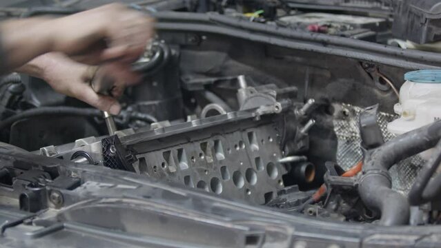 Repair and Assembly of Large Ratchet Wrench Parts of a Rebuilt Car Engine Footage.