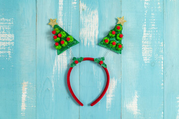 Christmas tree headband for kids on blue wooden background - 786698020