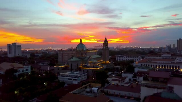 Aerial Forward Beautiful Shot Of Catholic Cathedral In City Under Cloudy Sky - Manila, Philippines