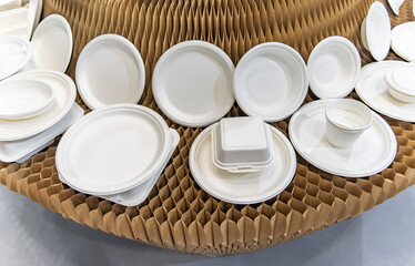 Set of unbleached plant fiber food box and paper cup. Natural fiber eco food and drink packaging.