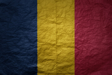 big national flag of chad on a grunge old paper texture background