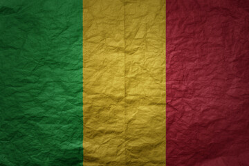 big national flag of mali on a grunge old paper texture background