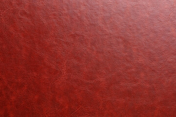 A red leather surface with a grainy texture