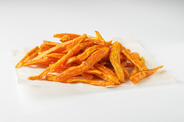 sweet potato fries on a white acrylic background