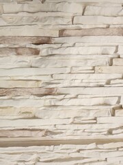 Whitewash brick wall texture background, stone pattern for interior and exterior design. Decorative stone cladding in modern and retro style. Suitable for residential and commercial projects.