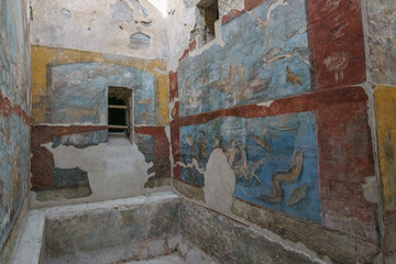 View from inside the ruins of ancient roman suburban baths with beautiful colored art on the wall...