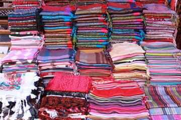 Pile of pashmina scarves for sale