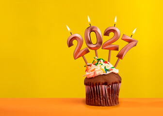 Candles number 2027 for happy new year - New years eve celebration on yellow background