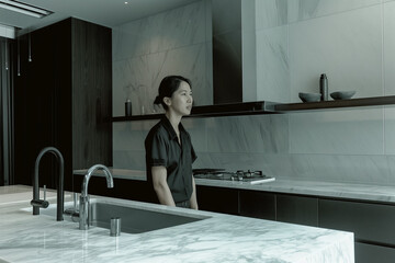 Fototapeta premium Urban Minimalist Kitchen with Open Shelving, Monochrome Gray Palette in an Apartment in Tokyo