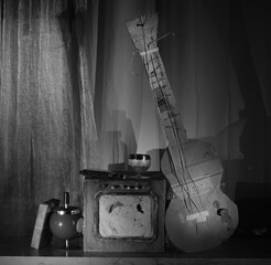 Grungy cardboard models of a electric blues guitar, a rough amplifier and a harmonica.Music,performance,blues and rock music style, instruments concept,black and white