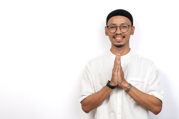Asian Muslim man giving Eid al-Fitr greetings