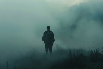 Obraz na płótnie Canvas Soldier in military gear walking into fog