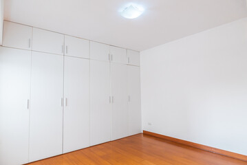 empty white room with wardrobe