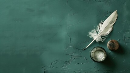 Antique quill and inkwell on weathered green desk surface
