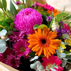 A close up of vibrant colourful floral arrangement, real photo. For florists, greetings, web, social media. 