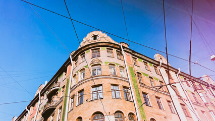 Historic building in centre of Saint-Petersburg. Travel Russia. St. Petersburg architecture low angle view. Soft focus. film grain pixel texture. Defocused.
