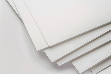 stack of white papers on light background