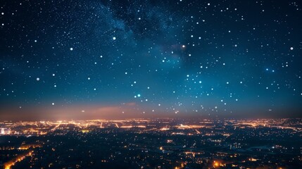 Starry night sky over city lights.