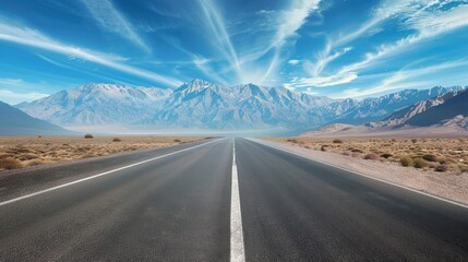 Straight asphalt road and mountain under blue sky. Highway and mountain background.